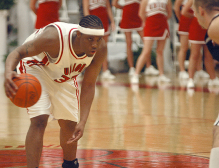 Mack Bealim eyes the defense as he runs the point for the Union men's basketball team. - Photo by Brad Moore