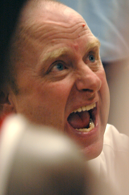 Head Coach Ralph Turner gets the men's basketball team fired up during their 76-51 victory over Freed Hardeman. - Photo by Brad Moore