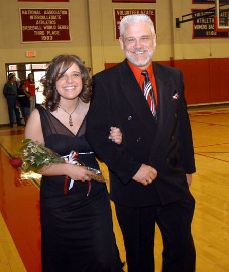 Freshman Kelly Northam, an undecided major from Houston, Texas, is escorted by her father Bruce Northam in the Homecoming Court processional. - Photo by Morris Abernathy
