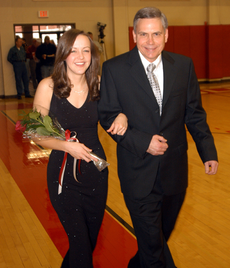 Senior Brooke Fowler, a biology major from Jackson, Tenn., is escorted by her father Rex Fowler in the Homecoming Court processional.  - Photo by Morris Abernathy