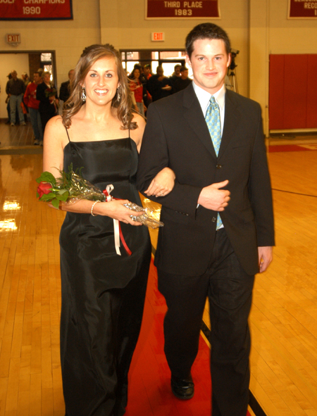 Kari Bachman is escorted by her fiance Paul Akin in the Homecoming Court processional. Kari is planning a career in trauma and intensive care. While at Union, Bachman has been a member of Chi Omega, the Student Nurses Association, the Baptist Student Nursing Association and the women’s varsity soccer team. - Photo by Morris Abernathy
