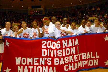Once again, Union's Lady Bulldogs pose with a national championship banner at Oman Arena. The 2006 title marks the second consecutive year Union has emerged from the 32-team tournament as the No. 1. - Photo by Morris Abernathy