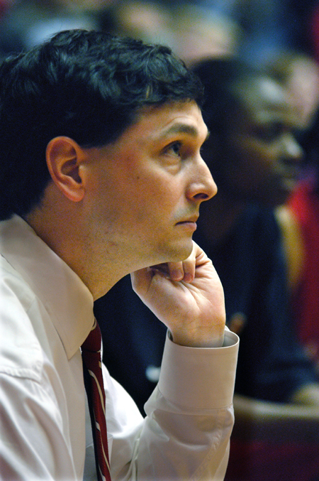 Head Coach Mark Campbell focuses on the game during the NAIA Women's Basketball National Championship Game.  - Photo by Jim Veneman