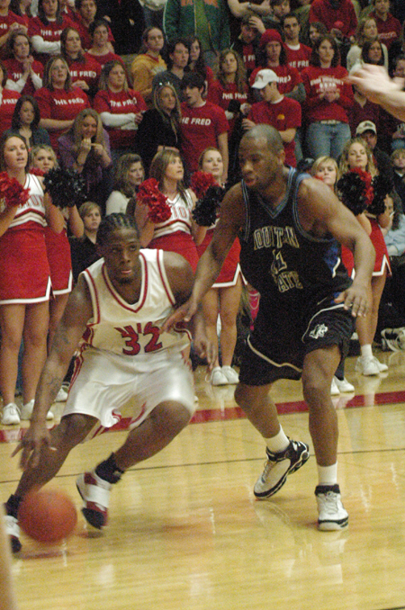 Mack Bealim (32) drives past a Mountain State defender in front of a packed student section in Union's homecoming win. - Photo by Steven Aldridge