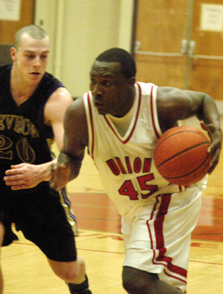 Senior guard Corey Burkett drives past a Trevecca Nazarene defender during a TranSouth Conference game. - Photo by Steven Aldridge
