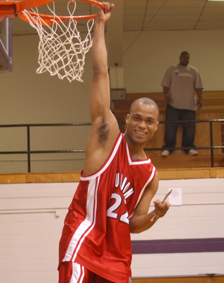 Senior guard Rod Ross celebrates Union's second straight TranSouth Tournament Title after cutting down his portion of the net.  - Photo by Steven Aldridge