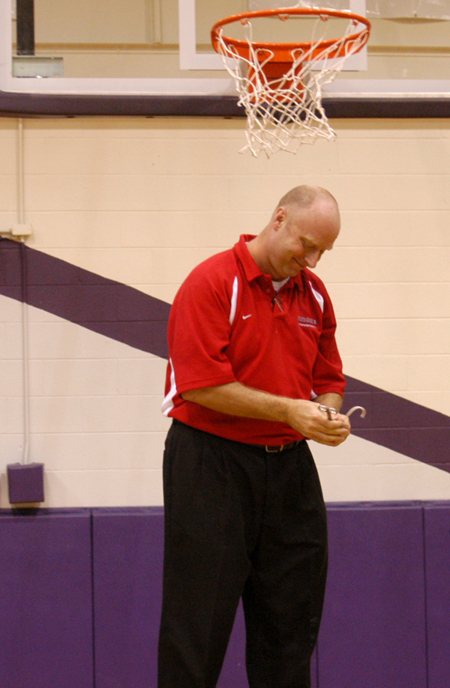 Union head coach Ralph Turner takes his piece of the net following Union's second straight TranSouth Tournament Title.  For Turner and Union, this marked their fifth TranSouth Championship in the 10-year history of the conference. - Photo by Steven Aldridge