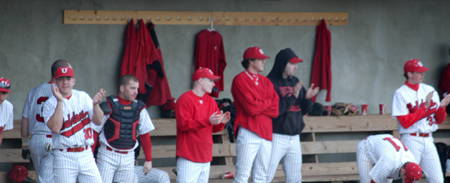 The Bulldogs cheer for their teammates on the field. - Photo by Steven Aldridge