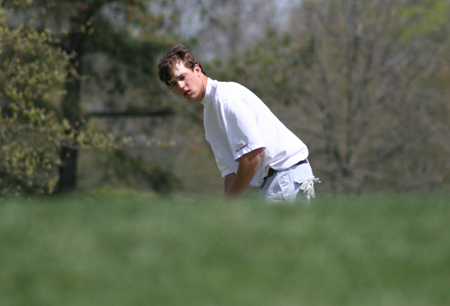 Cole Floyd eyes his the green prior to one of his chips in the TranSouth Conference Tournament.  Floyd finished fourth overall as Union captured the TranSouth Conference Championship. - Photo by Uncredited