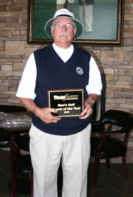 Long-time Union golf coach Don Morris stands with his 2006 TranSouth Coach of the Year Award after leading his team to the TranSouth Conference Title. - Photo by Uncredited