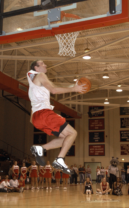 Senior Matt Noah (No. 22) wins the dunk contest with dunks like these. - Photo by Jim Veneman