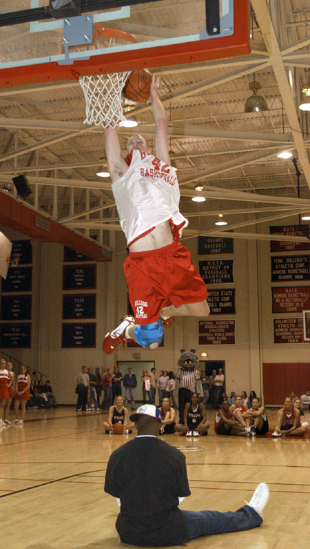 Sophomore Micheal Palmer (No. 42) attempts a dunk in the dunk contest. - Photo by Jim Veneman