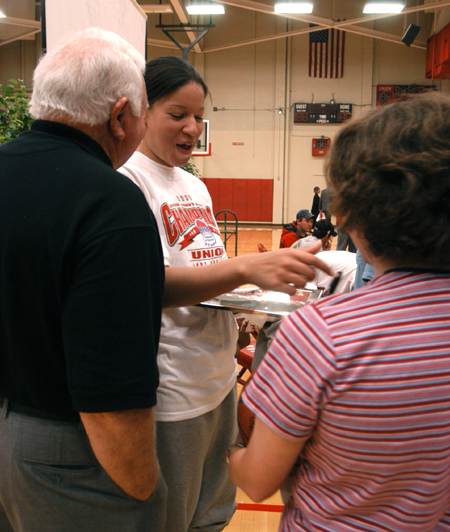 Senior guard Tiffany Fisher talks with several Union boosters after the April 7 celebration honoring Union's 2006 NAIA National Championship. - Photo by Heather Phillips