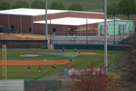 The Union baseball players arrive for practice at Union's Fesmire Field.  In the background, the new field house and indoor practice facility is nearing completion. - Photo by Morris Abernathy