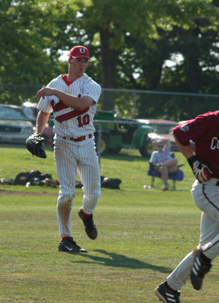 After fielding a bunt, sophomore pitcher Judson Powers tosses the ball to first base for the assist. - Photo by Steven Aldridge
