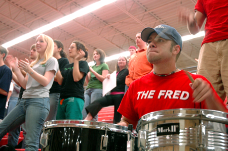 Union students, also known as Fred's Fanatics help get the cheers started from the balcony seats at Union's Fred DeLay Gymnasium. - Photo by Kristen Nicole Sayres