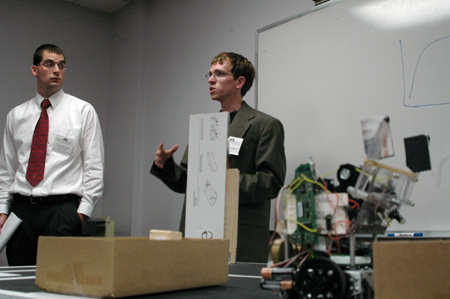 Engineering students David Foster and Josh Shrewsberry present their research on robotics during the Scholarship Symposium. - Photo by Kyle Kurlick