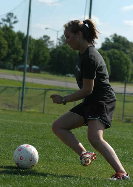 Megan Okerson works on her dribbling during drills at Union's spring practice. - Photo by Heather Phillips