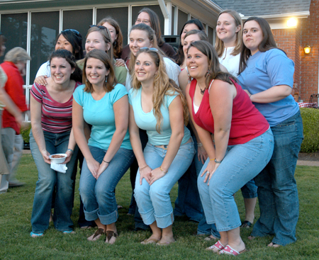 A group of graduating education majors pose for a photo at President Dockery's house during Happy Trails, a farewell event for graduating seniors sponsored by Young Alums. - Photo by Brad Moore