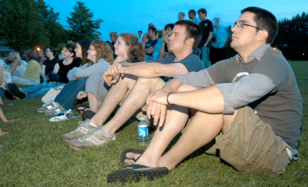 Sam Bullington, Jared Lawrence, Annie Ross, Rachel Melton, and other seniors reminisce during a slide show of memories from their time at Union while at President Dockery's house for Happy Trails, a farewell event for graduating seniors sponsored by Young Alums. - Photo by Brad Moore