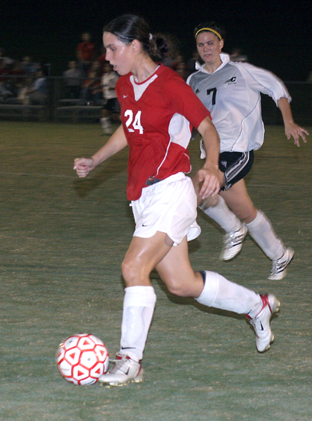 Nikki Burau (24) handles the ball during a soccer match in Union first season of varsity competition. - Photo by Kyle Kurlick