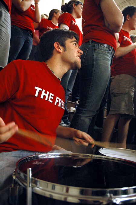 Andrew Burroughs gets the crowd pumped up for a men's basketball game. - Photo by Brad Moore