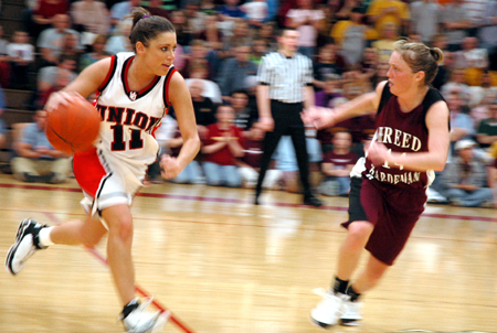 Jennifer Henson moves the ball upcourt in a Union win versus Freed-Hardeman. - Photo by Steven Aldridge