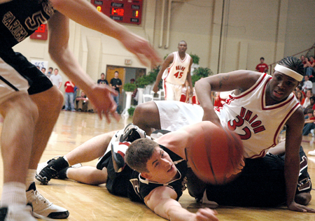 Mack Bealim (32), junior guard, fights for control of a loose ball. - Photo by Kristen Nicole Sayres