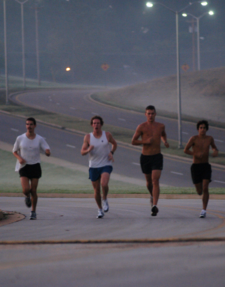 John Fox, Douglas Martin, Chris Arnold and Phillip Thompson of the men's cross country team practice early in the morning around Union's campus. - Photo by Brad Moore