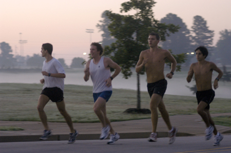 John Fox, Douglas Martin, Chris Arnold and Phillip Thompson of the men's cross country team practice early in the morning around Union's campus. - Photo by Brad Moore