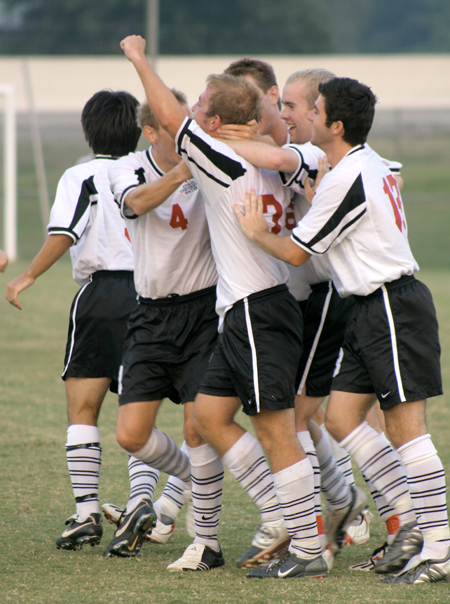 A group of Bulldogs celebrate together during a game early this season. - Photo by Kyle Kurlick