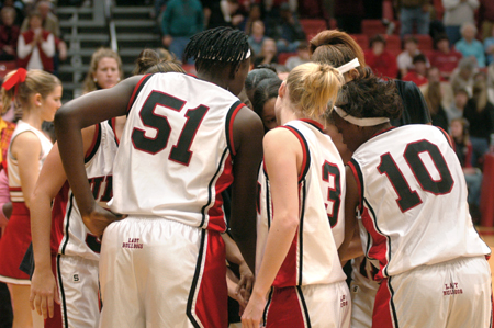 The Lady Bulldogs huddle before tip-off. - Photo by Brad Moore