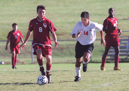 Sophomore Clovis Simas, international business major, chases down the offense in a recent game against Cumberland University TN.  Union won 4-2. - Photo by Jim Veneman