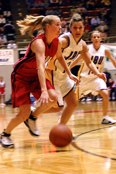 Union's Crystal Eason (3) drives past Lubbock Christian defenders.  Union defeated Lubbock Christian for their second straight NAIA National Title. - Photo by Stephanie Schroeder