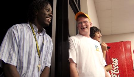 Kennedy Ogwambo and Joseph Ball get to know one another at the open mic night during New Student Orientation. - Photo by Kyle Kurlick
