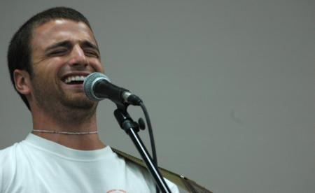 Life group leader Chris Rigney performs &ldquo;the death of white lightning&rdquo; at open mic during New Student Orientation.  - Photo by Matthew Diggs
