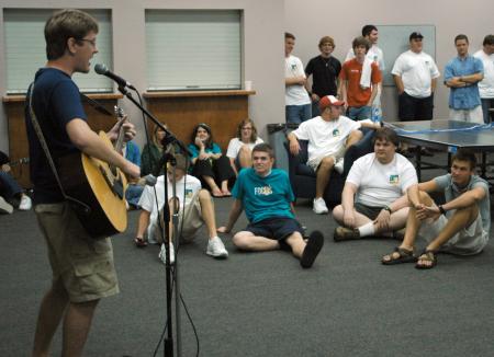 Junior Bryan Emerson performs at open mic night during New Student Orientation.  - Photo by Matthew Diggs