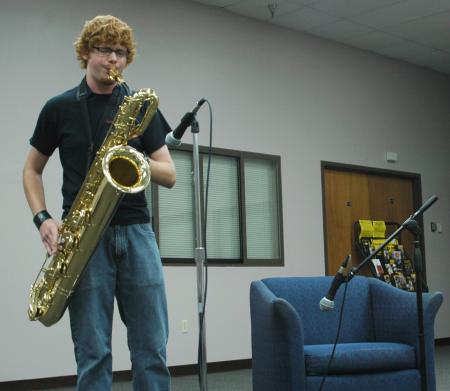Freshman Cory Taylor plays the saxophone at open mic night during New Student Orientation.  - Photo by Matthew Diggs