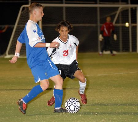 Freshman Paul Turner defends during the match against Lindsey Wilson College. - Photo by Morris Abernathy