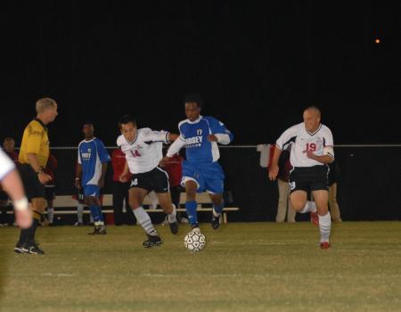 Bobby McColl (14) and Gareth Munro (19) track the ball during the match against Lindsey Wilson College. - Photo by Morris Abernathy