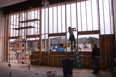 Repairs began Monday to the Hurt Commons that lost an entire wall of glass to the tornado. - Photo by Jim Veneman