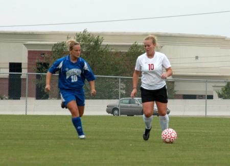 Cheslie Tharpe (10) brings the ball down the field with Brescia player in pursuit.  Union on the match 6-2. - Photo by Steven Aldridge