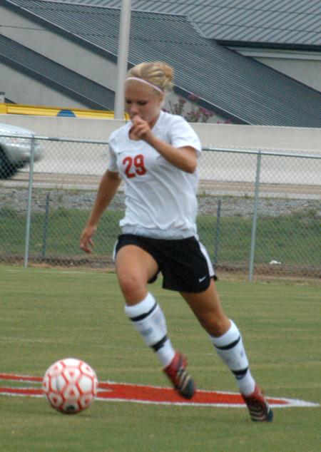 Freshman Caitlin Clinger dribbles the ball upfield. - Photo by Steven Aldridge