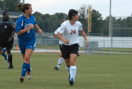 Bulldog sophomore Nikki Burau (24) runs downfield. - Photo by Steven Aldridge