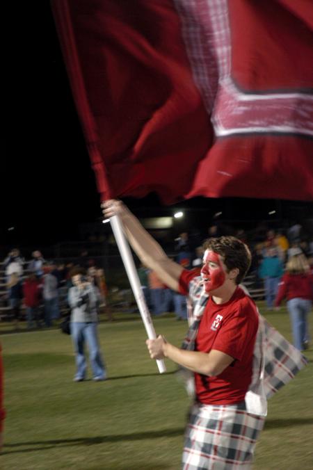 Jonathan Lambach waves the U flag after the men's soccer team wins 2-1 in overtime against Lindsey Wilson College. - Photo by Kyle Kurlick