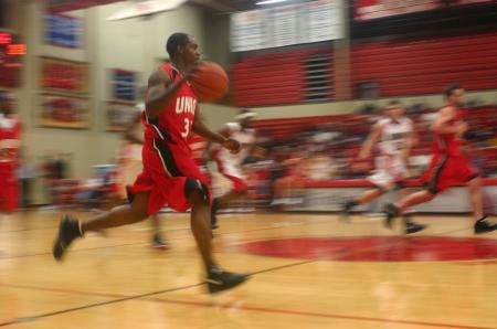 Sophomore Tony Brown drives the ball down court as in a Bulldog Madness scrimmage. - Photo by Stephanie Schroeder