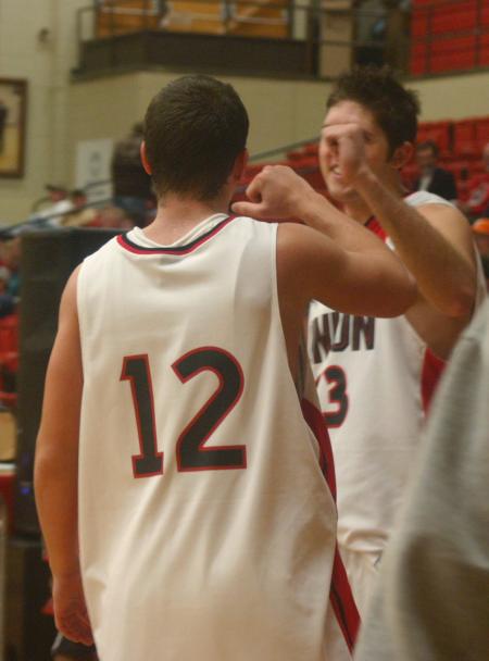 Junior Ryan Merriman congratulates Sophomore Alan North on his shots during a shoot out the night of Bulldog Madness. - Photo by Stephanie Schroeder