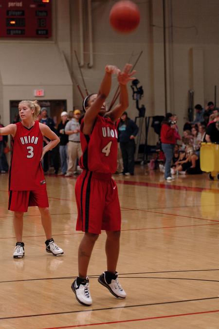 Jessica Graves takes a free throw while Crystal Eason looks on during the scrimmage at Bulldog Madness. - Photo by Holly Gushee