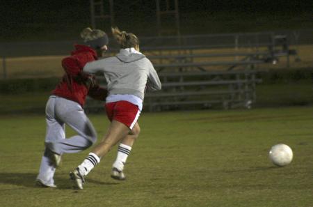 Sophomore Clair Yates attempts to make a goal against Lady Bulldog Lauren Williams in the soccer portion of Union's first annual Joes vs. Pros during Homecoming. - Photo by Stephanie Schroeder