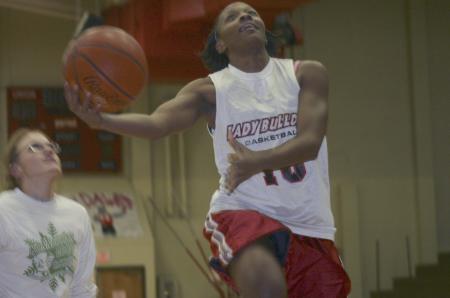 Senior Lady Bulldog Ena Daniels makes a basket against Freshman Leeanne Foster in the basketball portion of Union's first annual Joes vs. Pros. - Photo by Stephanie Schroeder